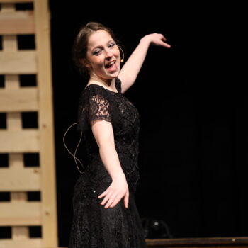 A student actress dances during the fall production of 