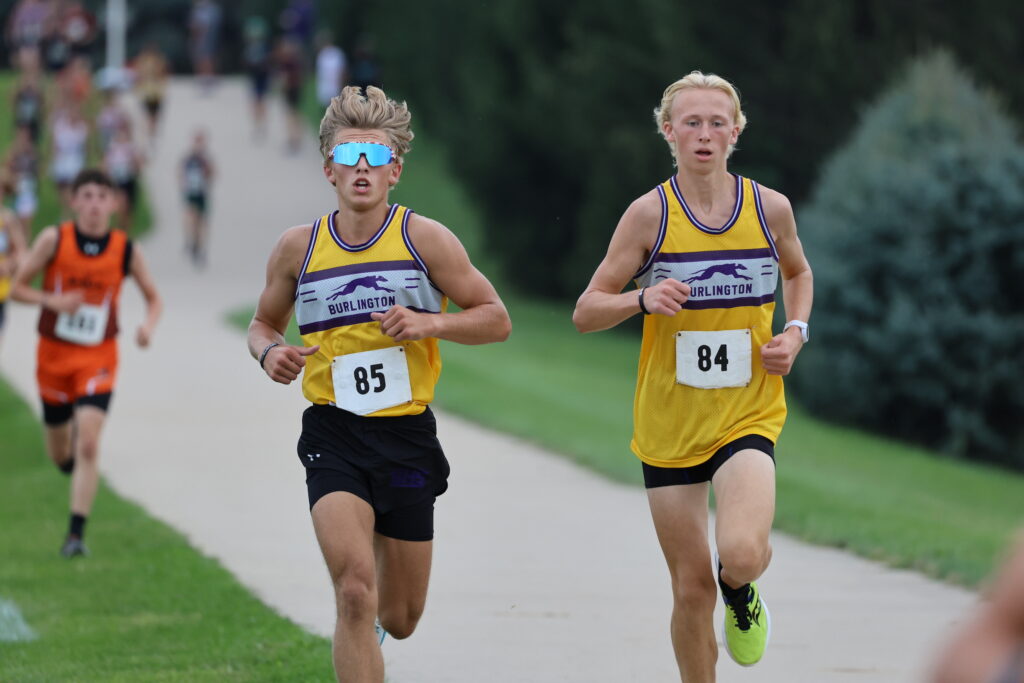 Two members of the BHS boys cross country team run during a cross country meet.