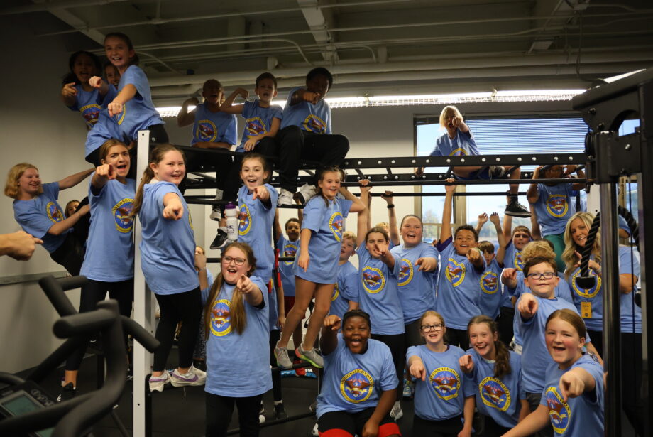 Student ambassadors pose for a photo Monday, Oct. 16, in Aldo Leopold Intermediate School’s DON’T QUIT Fitness Center following an assembly and ribbon cutting ceremony featuring Jake Steinfield (below) of the “Body by Jake” brand and chairman of the National Foundation for Governors’ Fitness Council.