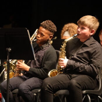 Two boys play the saxophone during their concert at Aldo Leopold Intermediate School.