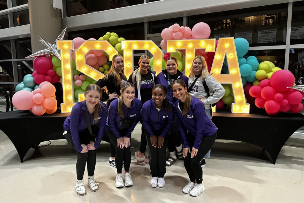 Members of the Burlington Dance Team pose for a photo at the Iowa State Dance and Drill Team Association.