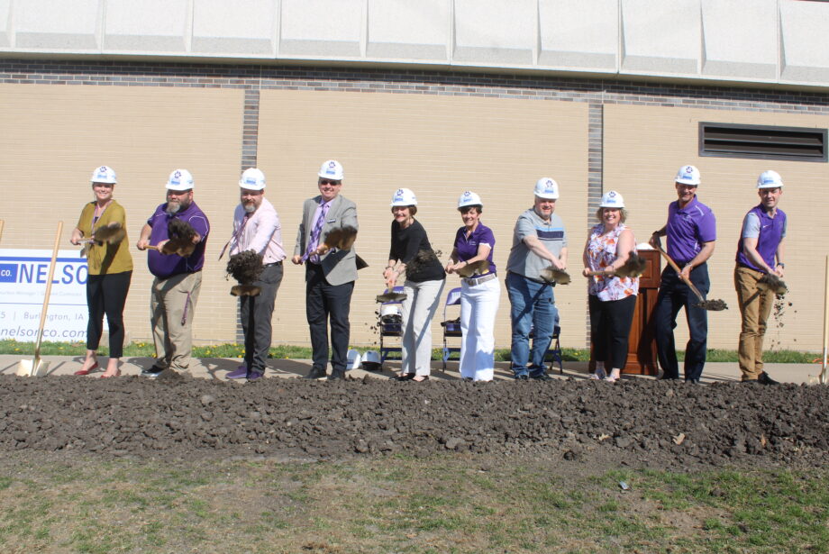 Burlington High School Assistant Principal Annie Perez, Athletic Director Jay Huff, Assistant Principal Nathan Marting, Superintendent Rob Scott, Burlington School Board President Deb Hatteberg, BHS Principal Monica Myers, school board members Darven Kendell and Anika McVay, Business Director Greg Reynolds and BHS Dean of Students Brandon Kurovski break ground Wednesday, April 12, 2023, at the site of the future weight room outside BHS during a groundbreakig ceremony.