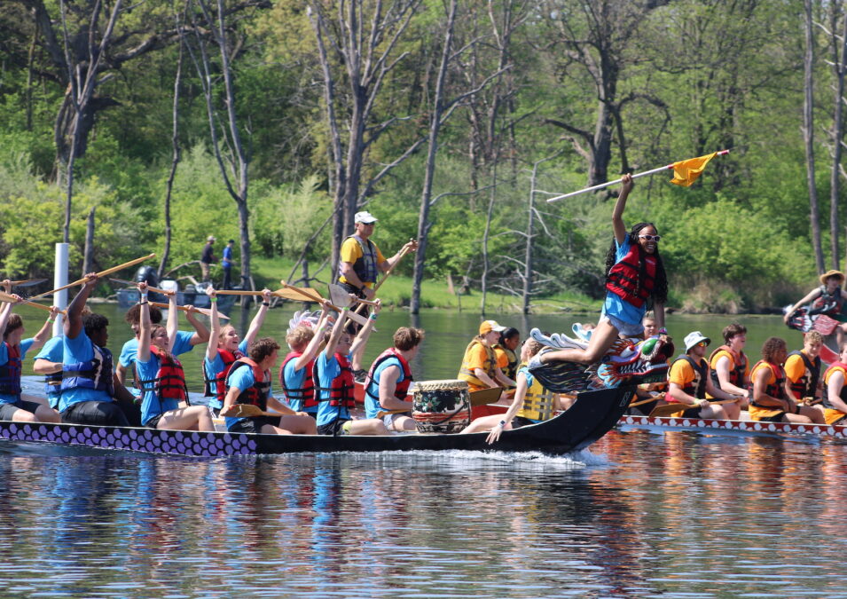 The Paddling Princesses celebrate Sunday, May 5, 2023, after besting their opponents during Dragon Boat Races at Big Hollow Recreation Area.