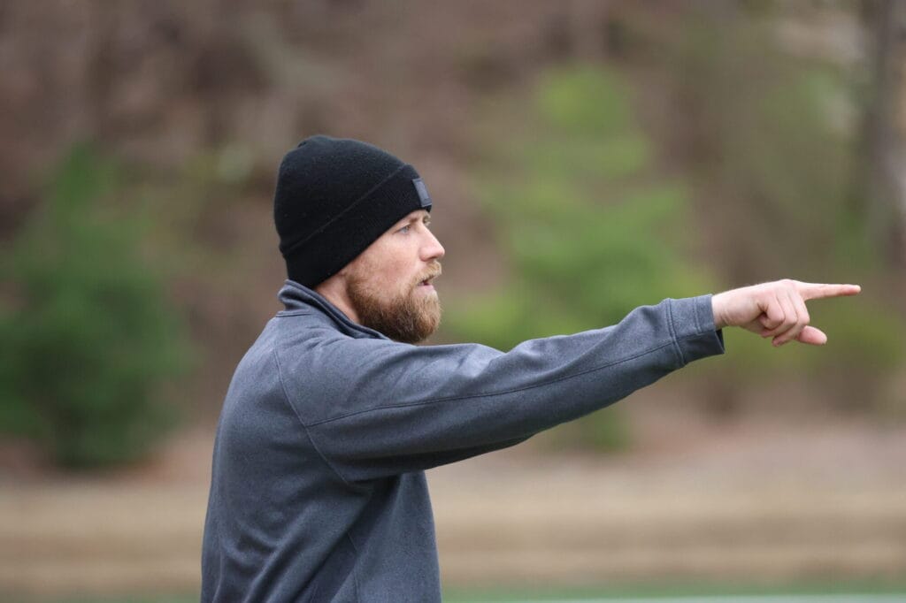 Then-assistant soccer coach Trevor Cushman is shown during a game April 2, 2024, at Bracewell Stadium. Now the head coach of Burlington High School’s boys soccer team, Cushman is carrying on a family legacy.