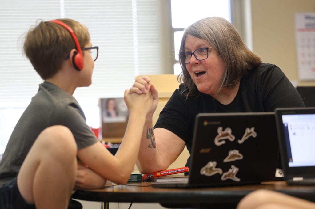 Kelli Bonar congratulates a student with a high-five Wednesday, May 28, 2025, in her classroom at Aldo Leopold Intermediate School.
