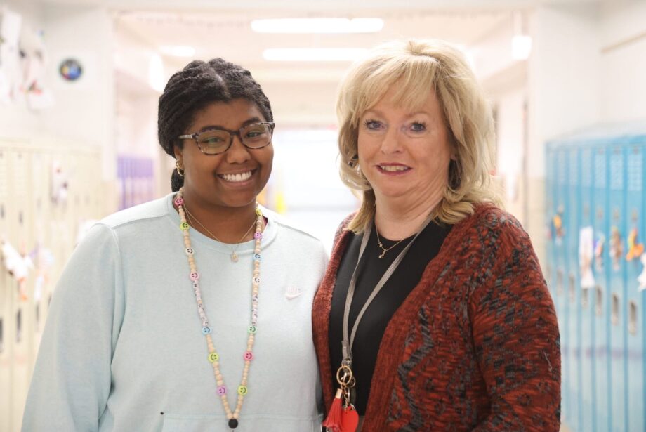 First-year teacher Michenna Davis poses for a photo alongside her teacher mentor, Tracy Walding, Nov. 25, 2024, outside of their third grade classrooms at North Hill Elementary School. They are among 37 mentees paired with 26 mentors this year via the district’s teacher mentor program.