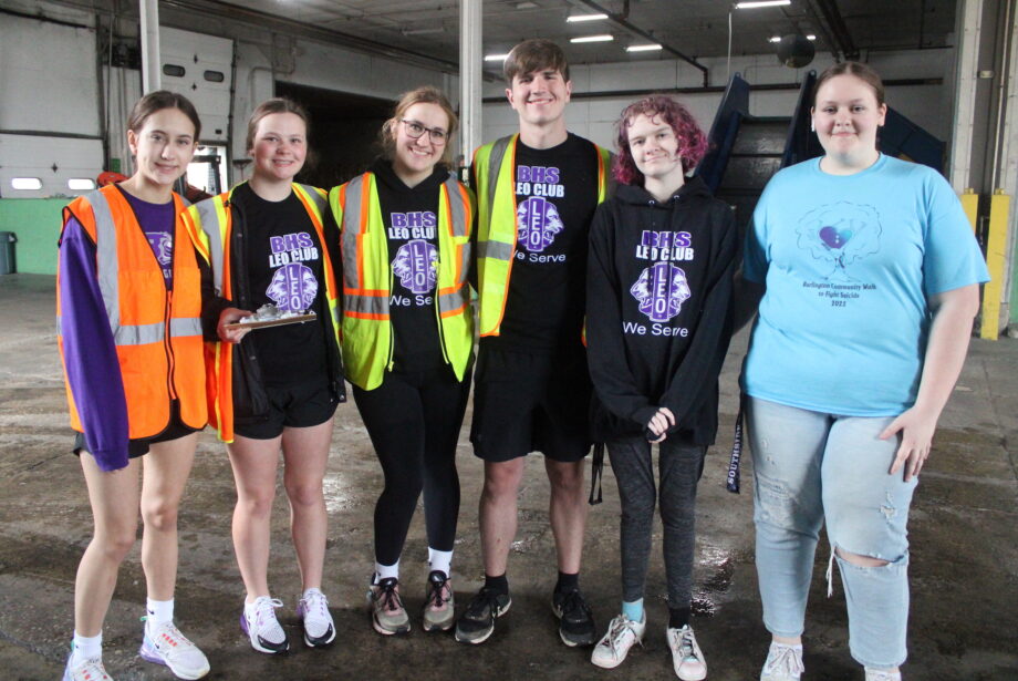 Burlington High School Leo Club members Lauren McDowell, Lauren Briggs, Hannah Wenzel, David King, Galilaia Sutton, and Hailie Brill pose for a photo Thursday, April 20, 2023, at Area Recyclers, where they were volunteering for Clean Out Your Files Day.