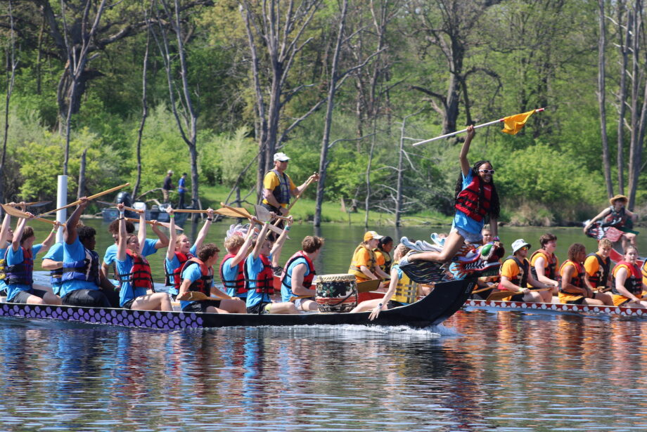 The Paddling Princesses celebrate Sunday, May 5, 2023, after besting their opponents during Dragon Boat Races at Big Hollow Recreation Area.