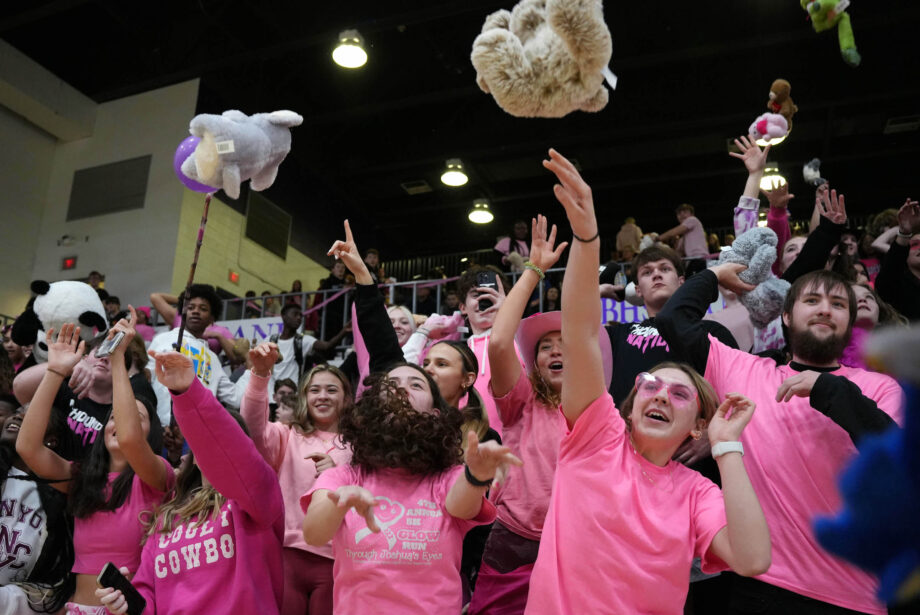 Students throw stuffed animals onto the court Feb. 7, 2023, at Burlington High School's Carl Johannsen Gymnasium during half-time of the boys basketball game against West Burlington for the BHS National Honor Society's Teddy Bear Toss. A total of 209 stuffed animals were donated.