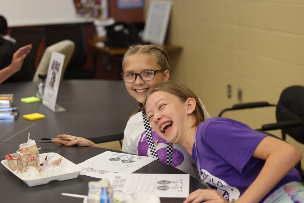 Friends Austyn Deuitch and Avery Irish share a laugh Sept. 17, 2024, during Girls Group. 