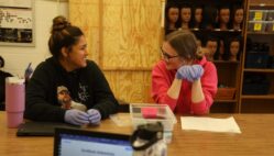 Students smile while practicing sanitization techniques Nov. 20, 2024, in Christa Whittemore’s Introduction to Cosmetology class at Burlington High School.