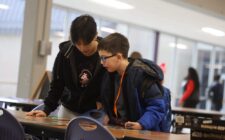 Burlington High School senior Sophie To and her mentee, third-grader Isaiah Rojas, play a “Star Wars”-themed game of Eye Found It Jan. 15, 2025, in the cafeteria at BHS. The duo are among 34 mentor/mentee pairs this year in Club M, which over its past 10 years has served 734 students.