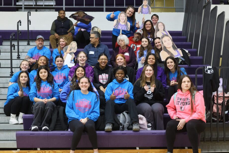 The girls wrestling team and their parents and coaches pose for a photo Feb. 5 ahead of a send-off assembly. Six girls wrestlers qualified for state: Alannah Peterson (5th place), Amaziah Twillie (6th place), Macy Peterson (6th place), Kiara Rodriguez (8th place), Mia Oddo and Grace Navarre.