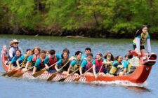 Burlington High School students row while competing Sunday, May 4, 2025, in the 35th annual Dragon Boat races at Lake Geode in Danville.