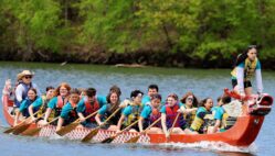 Burlington High School students row while competing Sunday, May 4, 2025, in the 35th annual Dragon Boat races at Lake Geode in Danville.