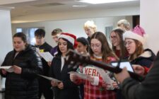 Burlington High School Student Council members sing carols Dec. 15, 2024, at RidgeView Assisted Living. It was among several carolling stops the students made in their quest to spread holiday cheer. The students also presented residents with hand-made holiday cards.