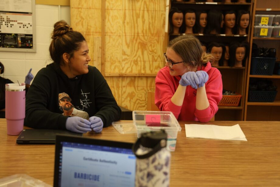 Students smile while practicing sanitization techniques Nov. 20, 2024, in Christa Whittemore’s Introduction to Cosmetology class at Burlington High School.