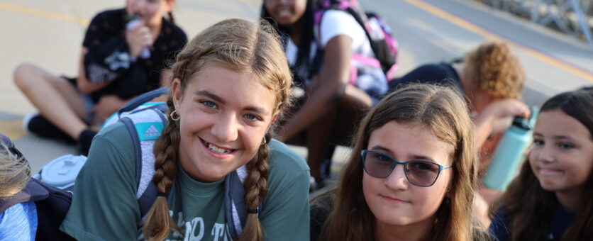 Two girls pose for a photo outside Aldo Leopold Intermediate School the morning of the first day of the school year.