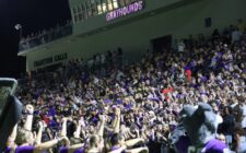 The stands of Bracewell Stadium are packed with purple Sept. 20, 2024, ahead of the varsity game against Mount Pleasant. The Homecoming game drew a larger than usual crowd that included a number of alumni from graduating classes spanning more than seven decades.