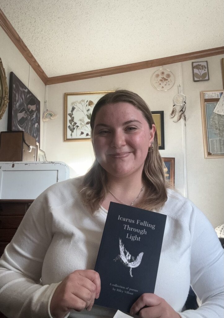 Burlington High School graduate Riley Villont poses for a photo while holding “Icarus Falling Through Light,” her book of 20 poems that was published this past August.