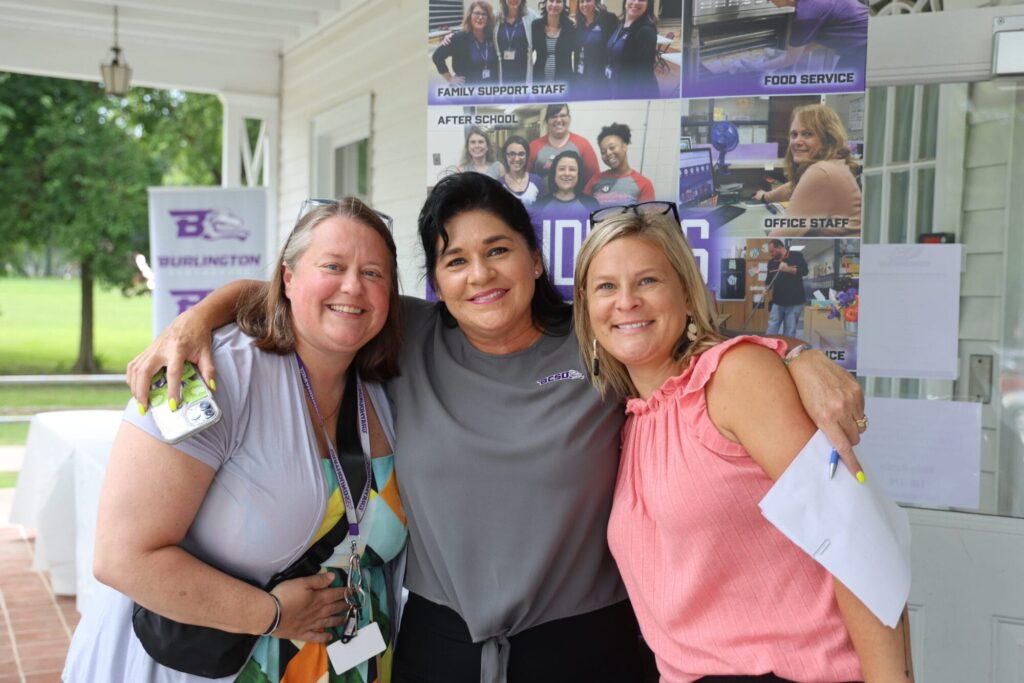 Human Resources Director Laci Johnson poses for a photo alongside VIBE Principal Laura Mickey, left, and Aldo Leopold Intermediate School Principal Sara Watkins, right, July 25, 2024, outside the Administration Building during the district’s annual job fair.  