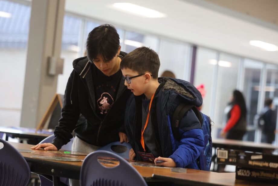 Burlington High School senior Sophie To and her mentee, third-grader Isaiah Rojas, play a “Star Wars”-themed game of Eye Found It Jan. 15, 2025, in the cafeteria at BHS. The duo are among 34 mentor/mentee pairs this year in Club M, which over its past 10 years has served 734 students.